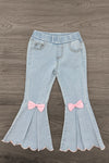 "Joy" Denim Flare Pant Set - 6-12 Months - Light-wash denim flare pants with an elastic waist, scalloped hems, and pink bows at the knees.