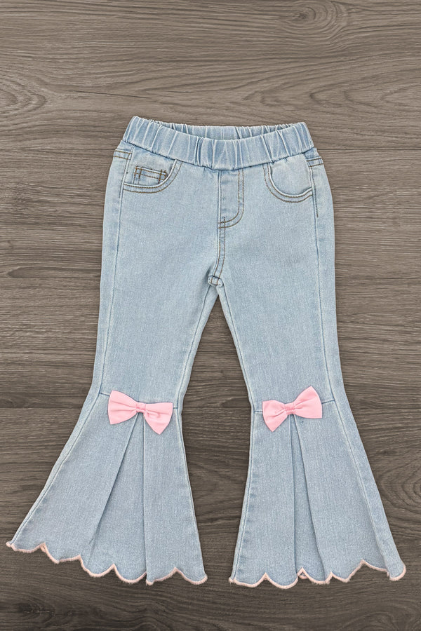 "Joy" Denim Flare Pant Set - 6-12 Months - Light-wash denim flare pants with an elastic waist, scalloped hems, and pink bows at the knees.