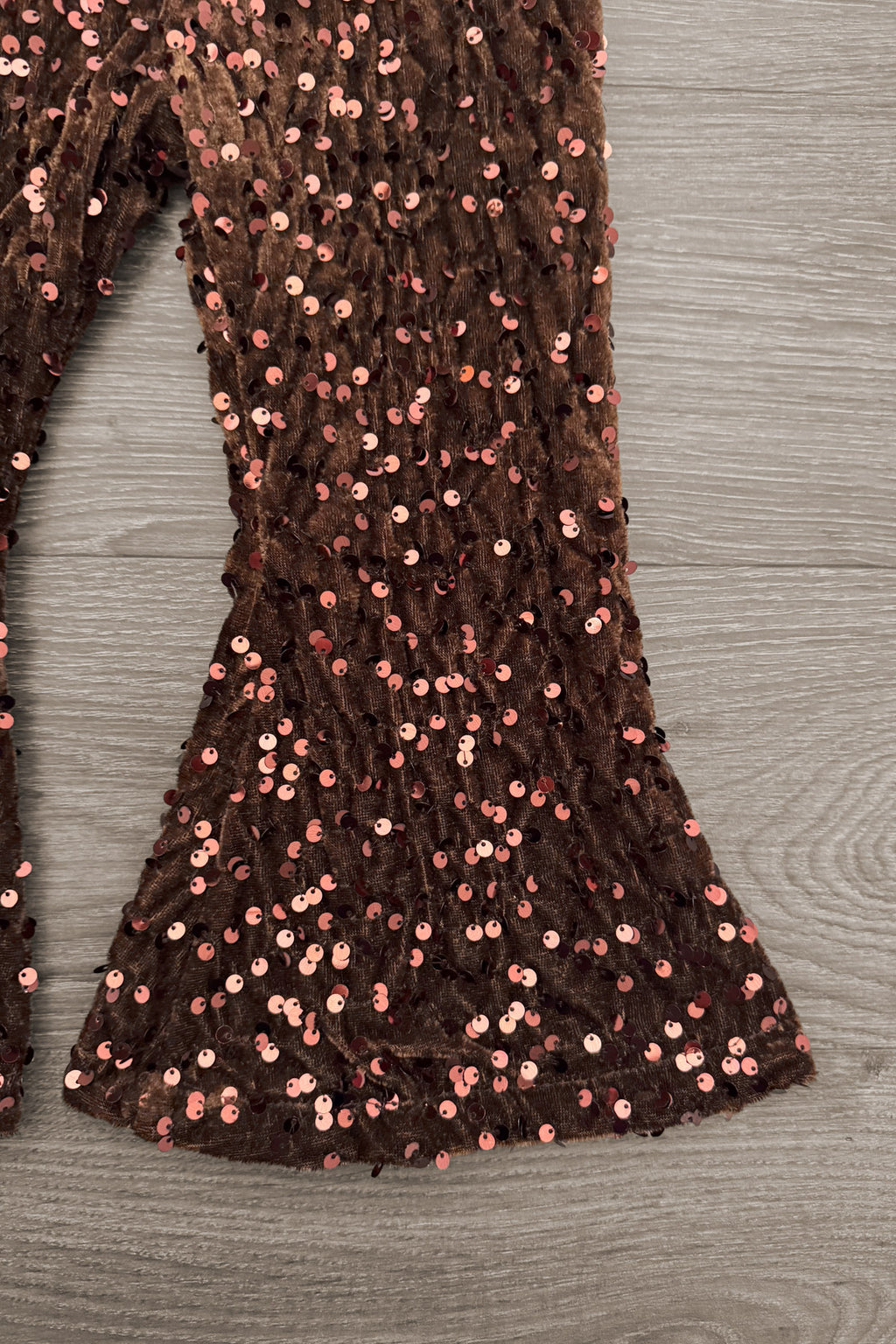 Bow Football Sequin Pant Set - 6-12 Months - Brown sequin flared pant legs with sparkling football-shaped patterns and a bell-bottom hem.