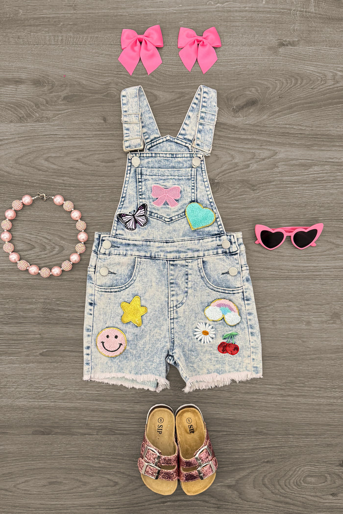 Summer Patches Denim Overalls - 6-12 Months - Denim toddler overalls with colorful summer patches, paired with pink bow clips, heart sunglasses, beaded bracelet, and.