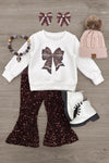 Bow Football Sequin Pant Set - 6-12 Months - White sweatshirt with a brown sequin football bow, paired with flared black sequin pants.