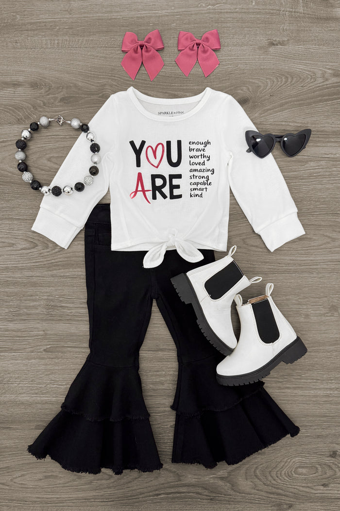 "You Are..." Black Denim Bell Bottom Set - 3XS-6-12 Months - White long-sleeve shirt with "You Are" text and black denim bell-bottom pants with ruffles, paired with black and white.