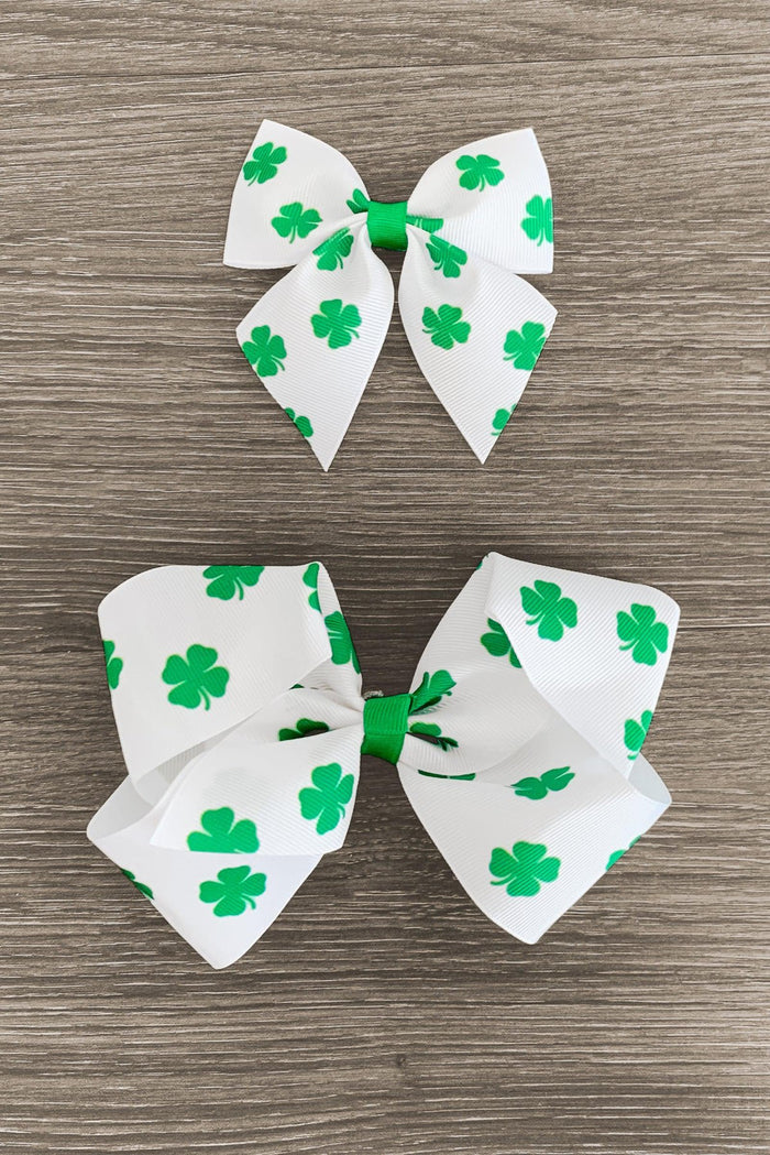 White Four Leaf Clover Bow - Small - White bows with green four-leaf clover patterns, one small and one large.