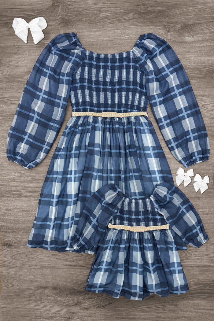 Mom & Me - Blue Plaid Dress - CHILD-3XS-6-12 Months - Matching blue plaid puff-sleeve dresses with smocked bodices, beige waistbands, and gathered skirts in adult and child sizes.