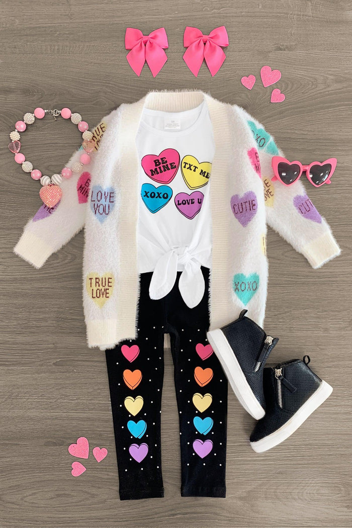 Rainbow Candy Hearts Legging Set - 3XS-6-12 Months - Cream cardigan with colorful candy heart patches, black leggings with rainbow hearts, navy boots, pink bow clips,.