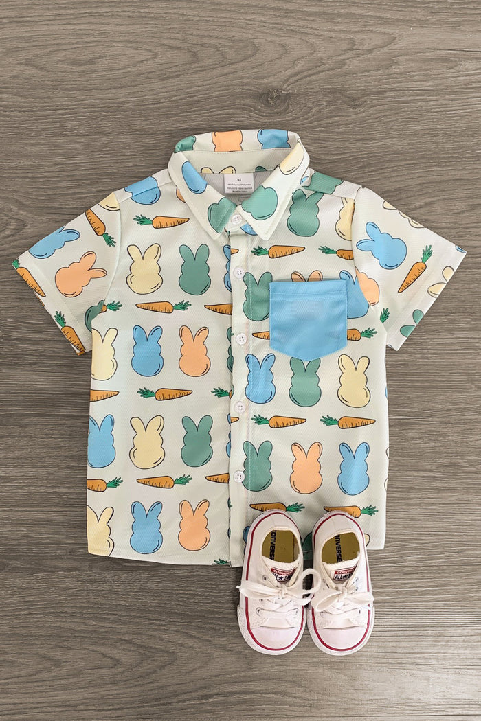 Mint Bunny Peep Button Down - 3XS-6-12 Months - Short-sleeve button-down shirt with pastel bunny print and blue chest pocket on wood background.
