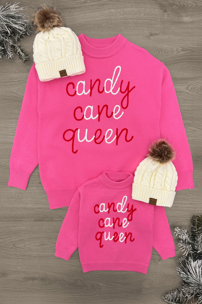 Mom & Me - "Candy Cane Queen" Pink Sweater - CHILD-3XS-6-12 Months - Bright pink sweaters with "Candy Cane Queen" script, paired with cream knit hats topped with brown pom-poms.