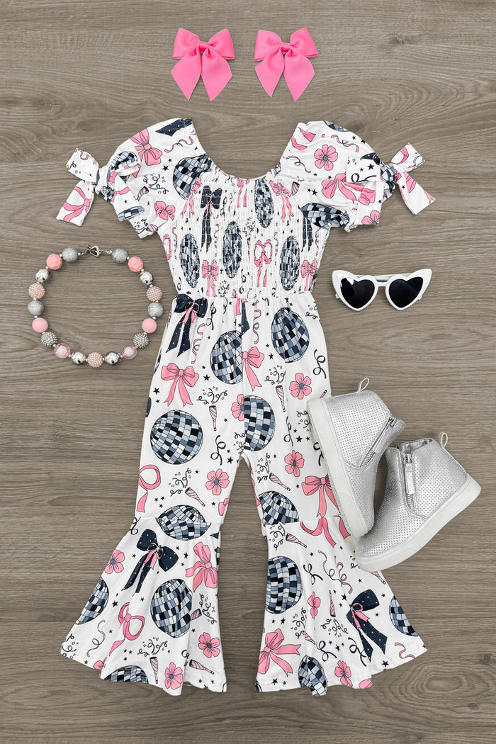 Disco Bell Bottom Jumpsuit - 3XS-6-12 Months - White bell bottom jumpsuit with black and pink disco ball pattern, puff sleeves, paired with white boots, pink hair bows,.