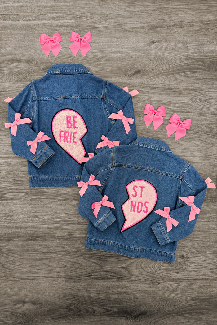 "Best Friends" Denim Jacket - Left Side / 3XS-6-12 Months - Two children's denim jackets with pink heart patches and matching pink bows, "Best Friends" design split between them.