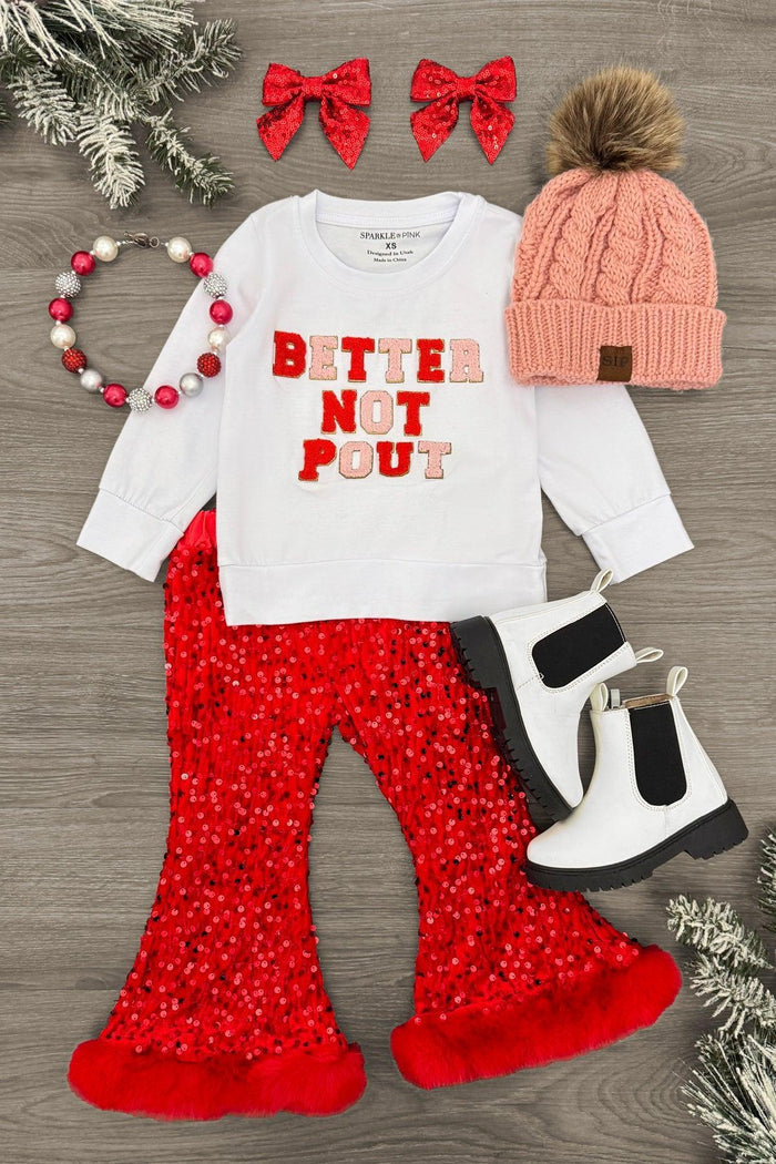 "Better Not Pout" Sequin Flare Set - 3XS-6-12 Months - Toddler outfit with white long-sleeve top saying "Better Not Pout," red sequin flare pants, white and black boots, pink knit .