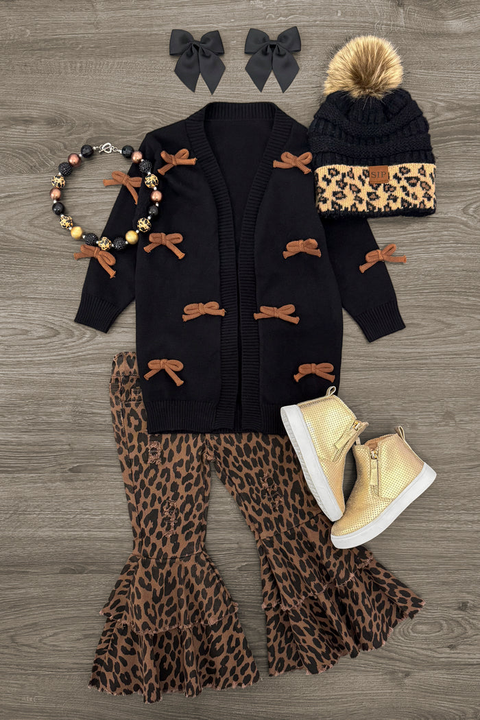 Black & Brown Bow Cardigan - 3XS-6-12 Months - Black cardigan with brown bow accents paired with leopard print bell-bottom pants and matching hat with pom-pom and leopard.