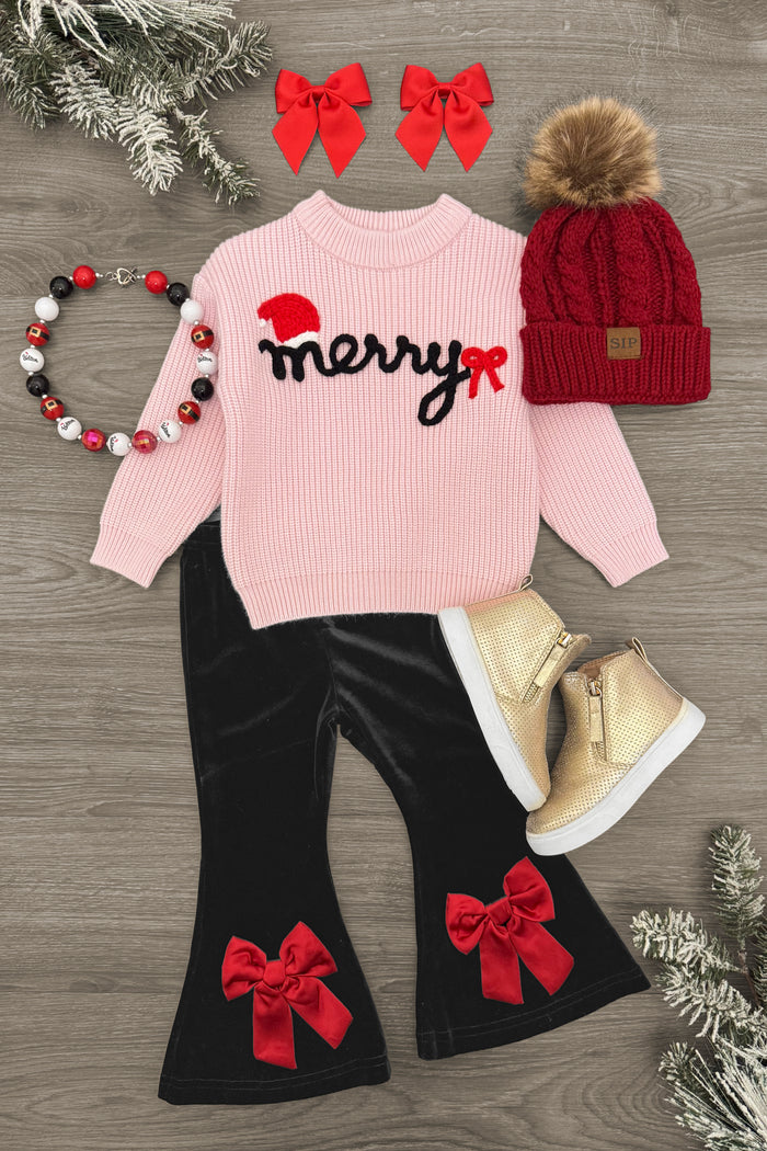 "Merry" Knit Sweater Velvet Flare Pant Set - 3XS-6-12 Months - Pink knit sweater with "merry" text, black velvet flare pants with red bows, red knit hat with pom-pom, gold boots, and red.