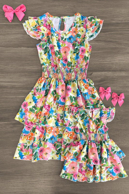Mom & Me - Floral Watercolor Dress - CHILD-3XS-6-12 Months - Matching floral watercolor dresses with pink, green, and orange hues, featuring ruffled sleeves and tiered skirts, displayed .