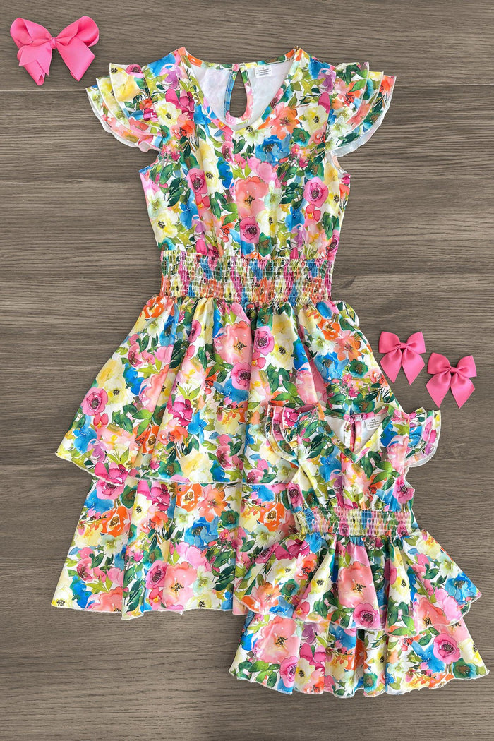 Mom & Me - Floral Watercolor Dress - CHILD-3XS-6-12 Months - Matching floral watercolor dresses with pink, green, and orange hues, featuring ruffled sleeves and tiered skirts, displayed .