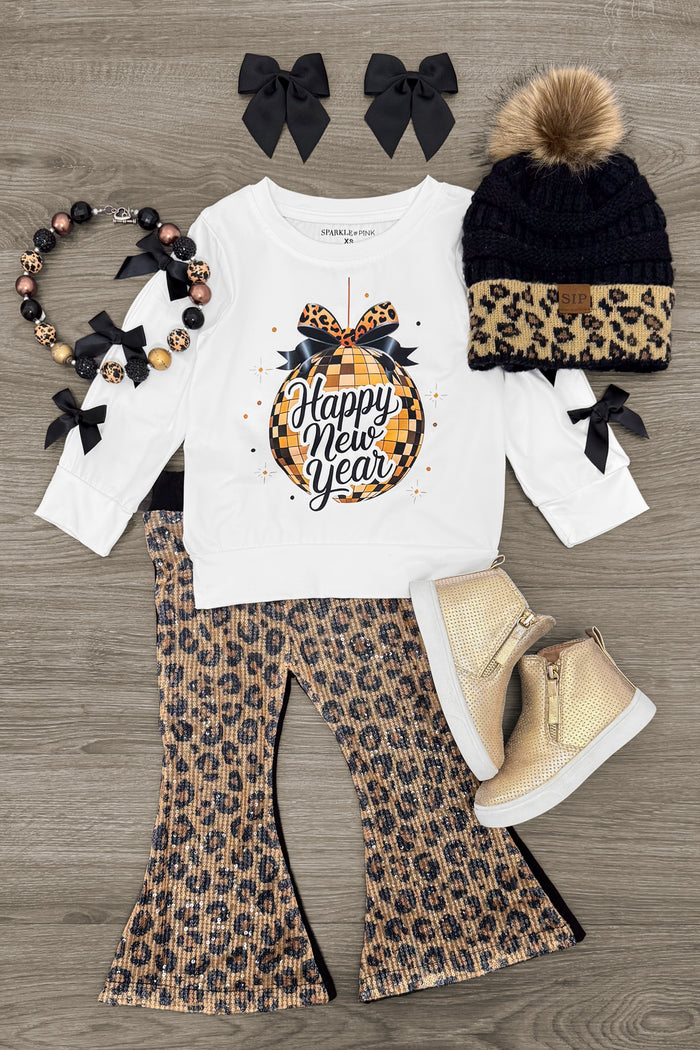 "Happy New Year" Sequin Leopard Flare Set - 3XS-6-12 Months - Toddler white long-sleeve shirt with "Happy New Year" and leopard bow, matching leopard flare pants, leopard beanie with.