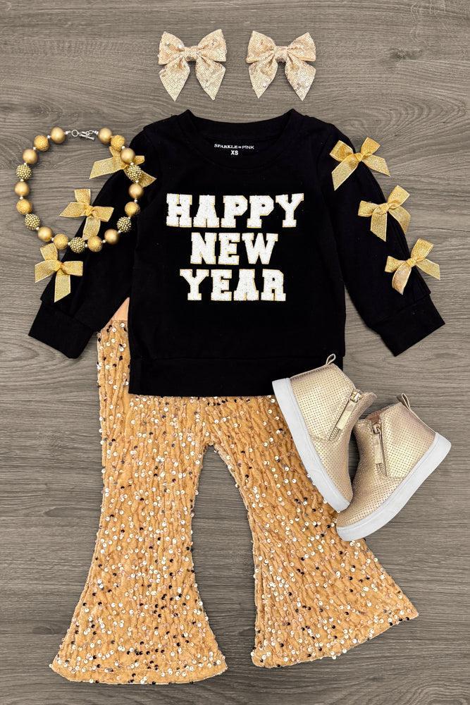 "Happy New Year" Gold Sequin Flare Set - 3XS-6-12 Months - Black long-sleeve toddler top with "Happy New Year" text and gold bows on sleeves, paired with gold sequin flare pants and.