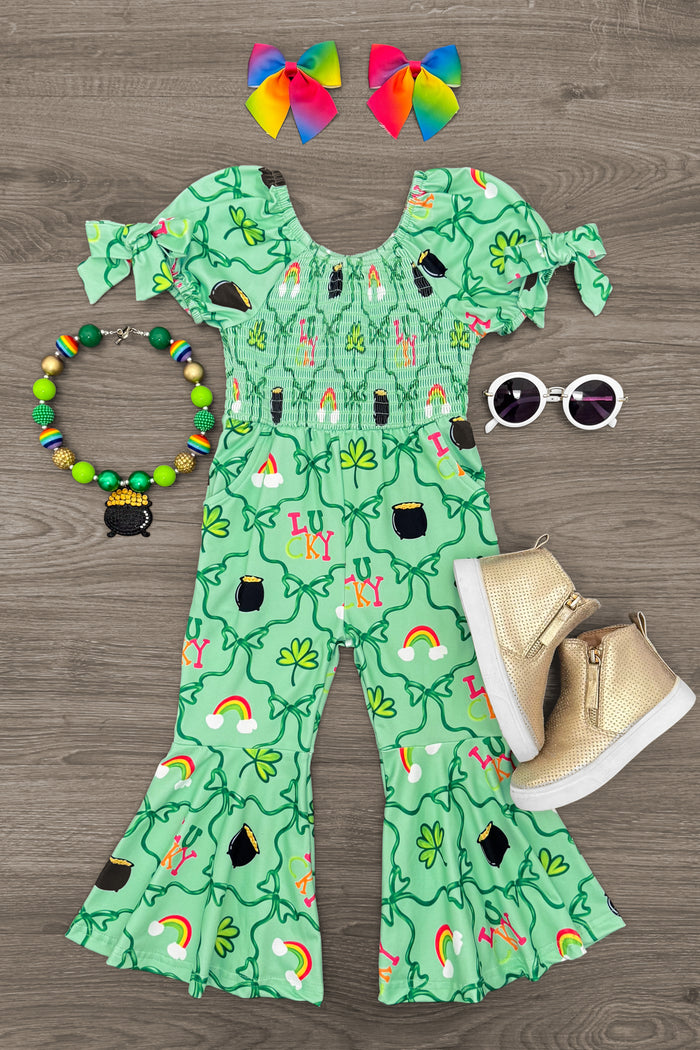 "Lucky" Green Bell Bottom Jumpsuit - 6-12 Months - Green bell bottom jumpsuit with clover and rainbow print, puff sleeves, and ruffle hems.