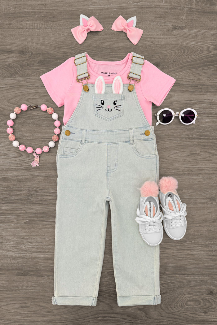 Pink Denim Bunny Overall Set - 6-12 Months - Light pink short-sleeve shirt with gray denim bunny overalls, paired with white shoes, pink bow headbands, sunglasses, and a .