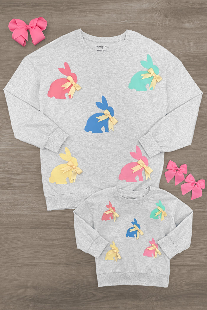 Mom & Me - Gray Bunny Bows Top - CHILD-6-12 Months - Gray sweatshirt with colorful bunny bow designs in pink, blue, yellow, and teal, styled with pink and red hair bows.