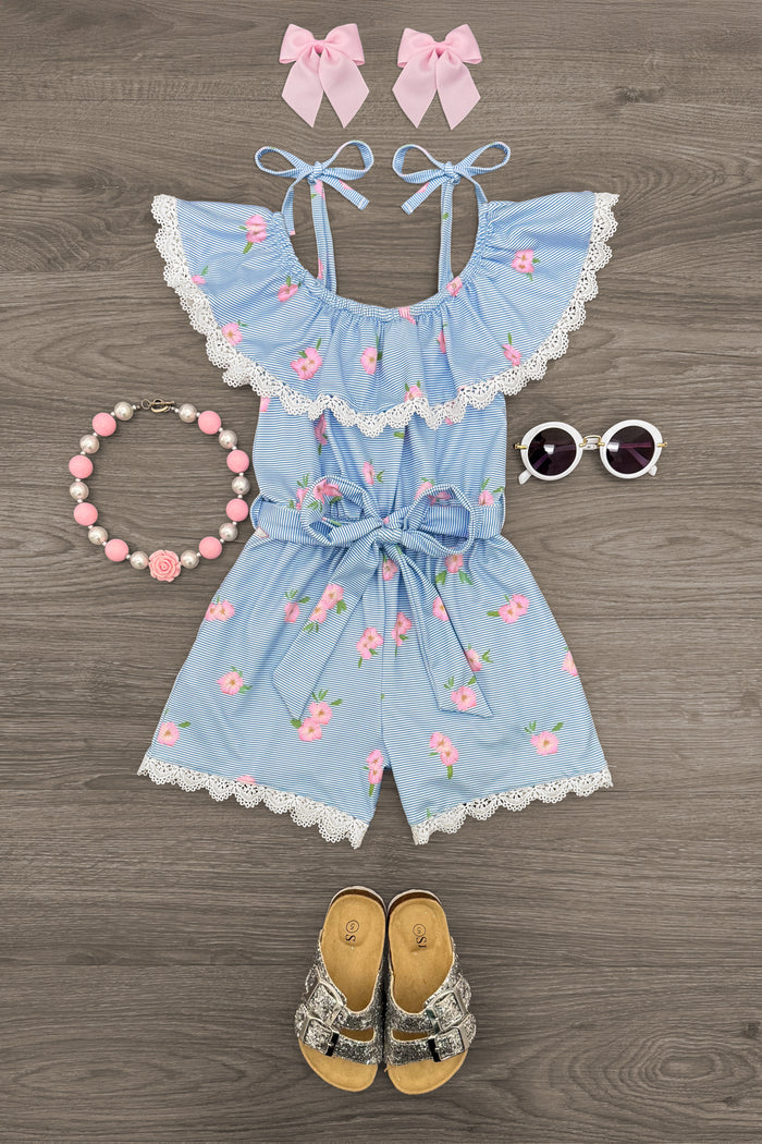 Blue Striped Floral Romper - 6-12 Months - Blue and white striped romper with pink floral print, ruffled neckline, bow tie waist, and scalloped edges, styled with pink .