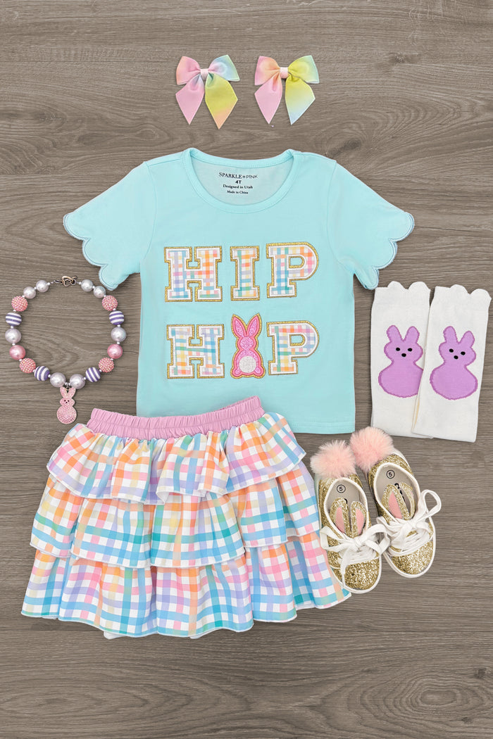 "Hip Hop" Rainbow Plaid Skirt Set - 6-12 Months - Light blue short-sleeve top with "HIP HOP" in colorful letters, rainbow plaid tiered skirt, matching pastel bows, beaded.