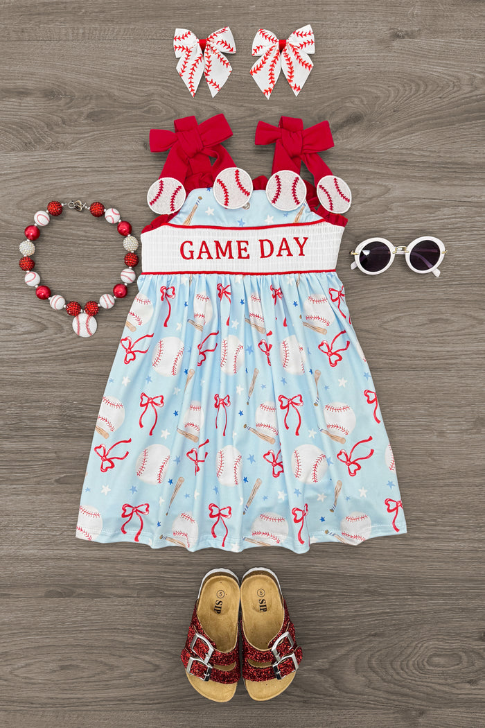 "Game Day" Baseball & Bows Dress - 6-12 Months - Light blue sleeveless dress with red baseball bat and ball print, red "Game Day" waistband, paired with red bows, beaded.
