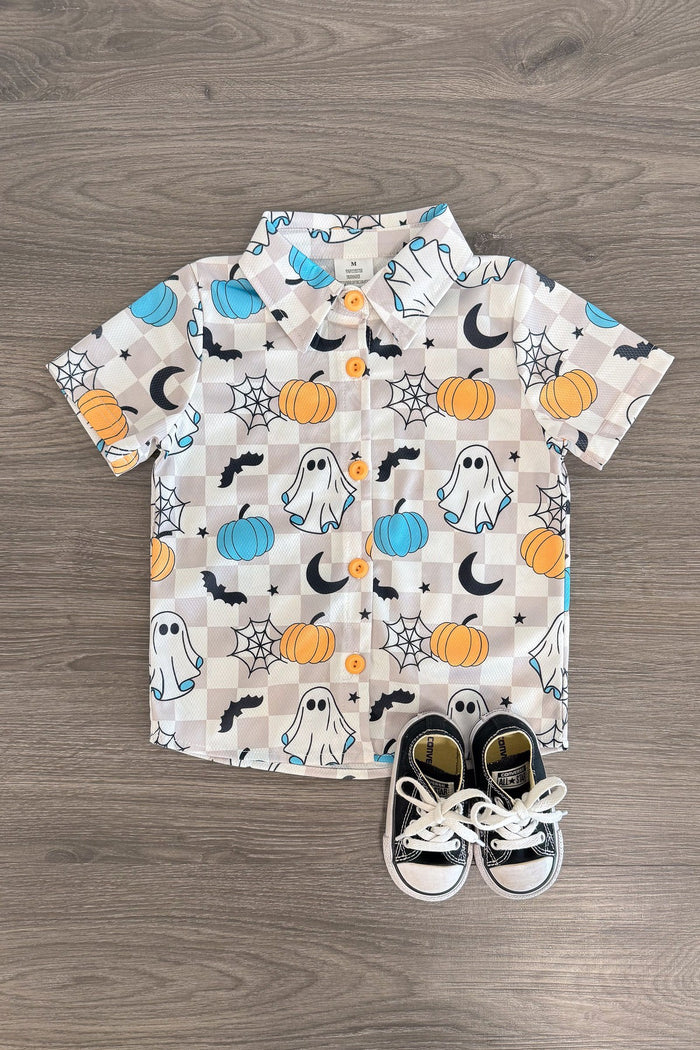 Spooky Checkered Button Down Top - 3XS-6-12 Months - White short-sleeve button-down shirt with blue ghosts, orange pumpkins, and black moons print on wood floor background.