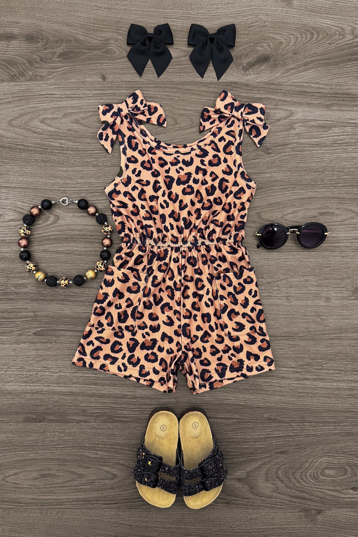 Cheetah Print Romper - 6-12 Months - Sleeveless cheetah print romper with ruffled shoulder details for toddlers, paired with black bow clips, beaded bracelet,.