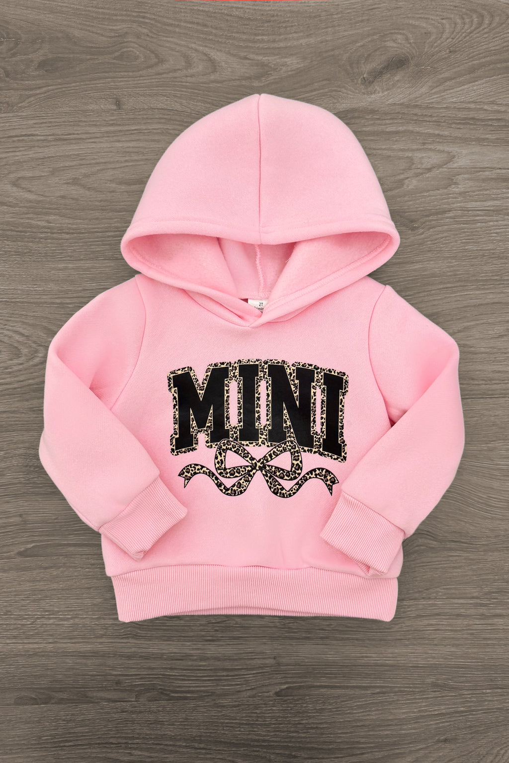 Mom & Me - "Mama & Mini" Pink Cheetah Pullover - 6-12 Months - Pink toddler pullover hoodie with "MINI" black and cheetah print lettering and drawn hearts on front.
