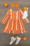 Pumpkins & Bows Stripe Dress - 6-12 Months - Orange long-sleeve striped dress with pumpkin and bow patterns, paired with white socks and orange bow, beige high-top.