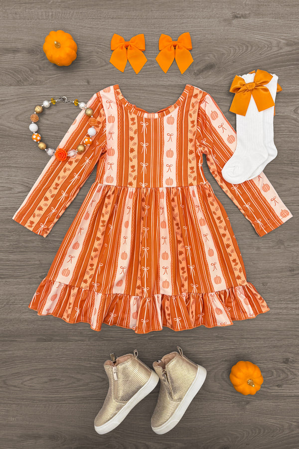 Pumpkins & Bows Stripe Dress - 6-12 Months - Orange long-sleeve striped dress with pumpkin and bow patterns, paired with white socks and orange bow, beige high-top.