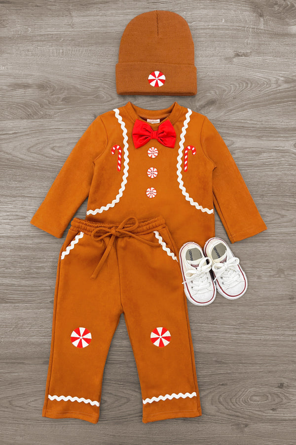 Gingerbread Man Costume - 6-12 Months - Orange gingerbread man costume with white icing trim, red bow tie, candy buttons, matching hat, and white baby shoes.