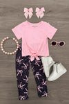 Pink & Black Bow Legging Set - 6-12 Months - Pink short-sleeve top with a front tie, black leggings with pink bows, and matching pink hair bows.