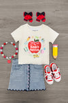 "Pre-K - Fifth Grade" Apple Denim Skirt Set - PRE-K / 2T - Cream short-sleeve tee with colorful apple graphic, light denim skirt with scalloped hem, red and white sneakers, red hair.