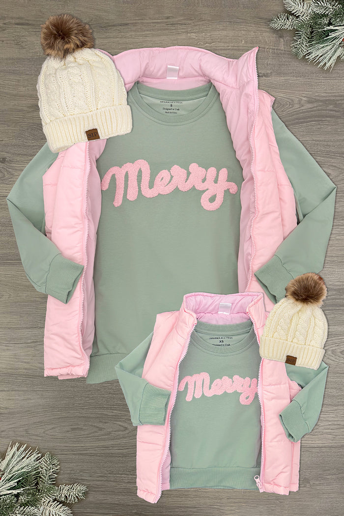 Mom & Me - "Merry" Pastel Puffer Vest Set - CHILD-3XS-6-12 Months - Mint green long-sleeve shirt with pink "Merry" text paired with a pastel pink puffer vest and cream knit beanie with brown.
