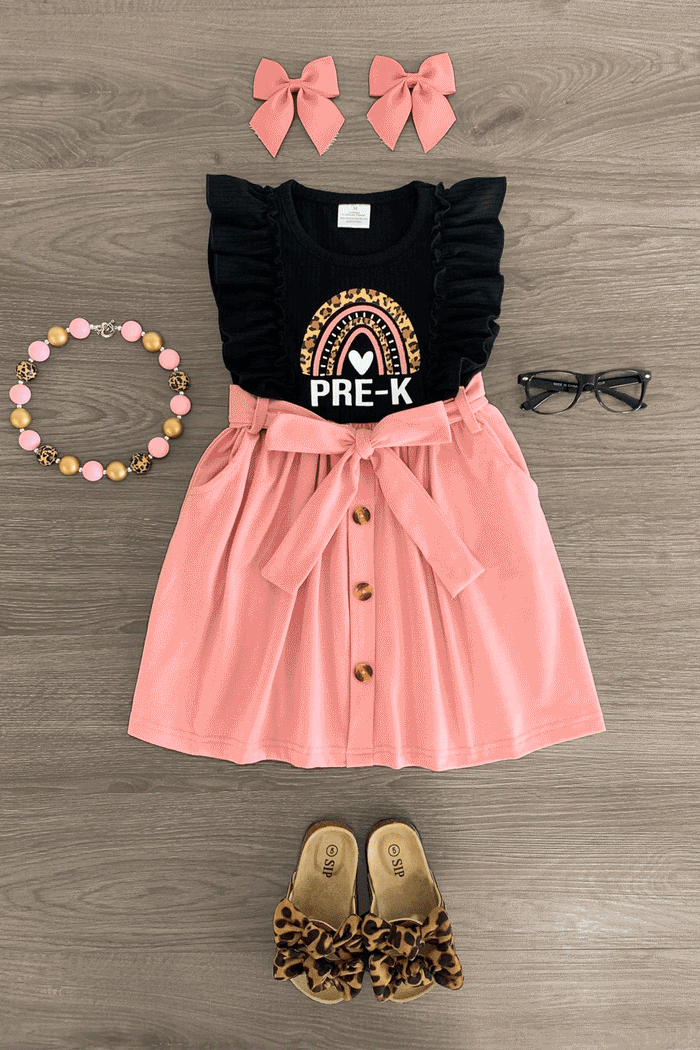 "Pre-K - 4th Grade" Black & Pink Dress - PRE-K / 3XS-6-12 Months - Black ruffled sleeve top with rainbow and "PRE-K" text, pink button-front skirt with bow, leopard print sandals, pink bows,.