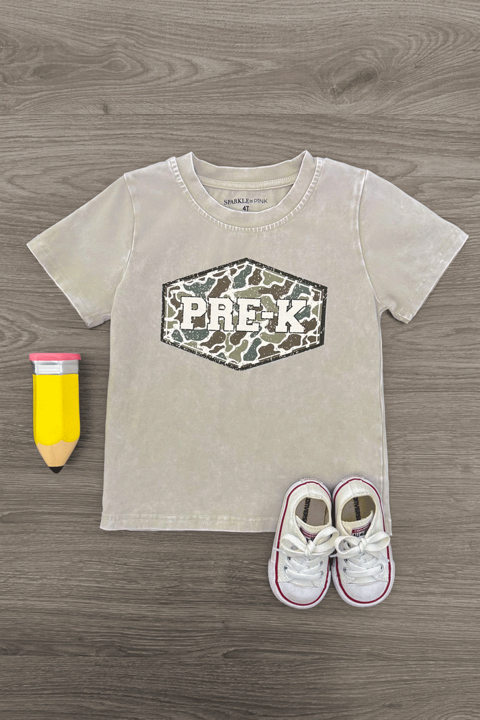 "Pre-K - Sixth Grade" Gray Camo Top - PRE-K / 2T - Light gray camo short-sleeve top with hexagonal PRE-K logo on front, laid flat with yellow pencil and white toddler sneakers.