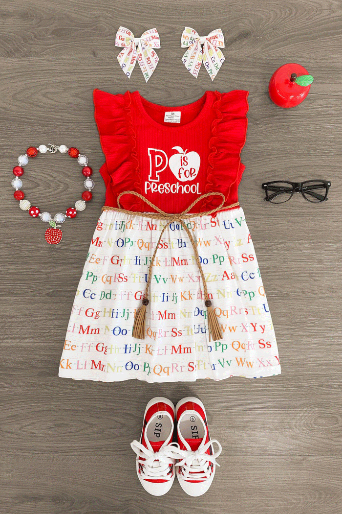 "Preschool - 4th Grade" Rainbow Alphabet Dress - PRESCHOOL / XS-2T - Red sleeveless dress with ruffled shoulders, "Preschool" and apple print top, white skirt with colorful alphabet letters,.