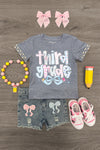 "Pre-K - Sixth Grade" Plaid Bow Denim Short Set - THIRD GRADE / 7 - Gray short-sleeve tee with plaid ruffle sleeves and "third grade" text paired with distressed denim shorts featuring pink.