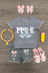 "Pre-K - Sixth Grade" Plaid Bow Denim Short Set - PRE-K / 2T - Gray short-sleeve shirt with "Pre-K" and plaid bow graphic, paired with distressed denim shorts featuring matching plaid.