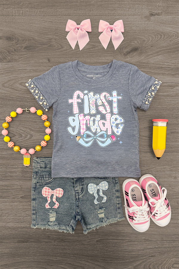 "Pre-K - Sixth Grade" Plaid Bow Denim Short Set - FIRST GRADE / 4T - Gray short-sleeve shirt with "first grade" text and plaid bow accents, denim shorts with plaid bow patches, pink sneakers,.