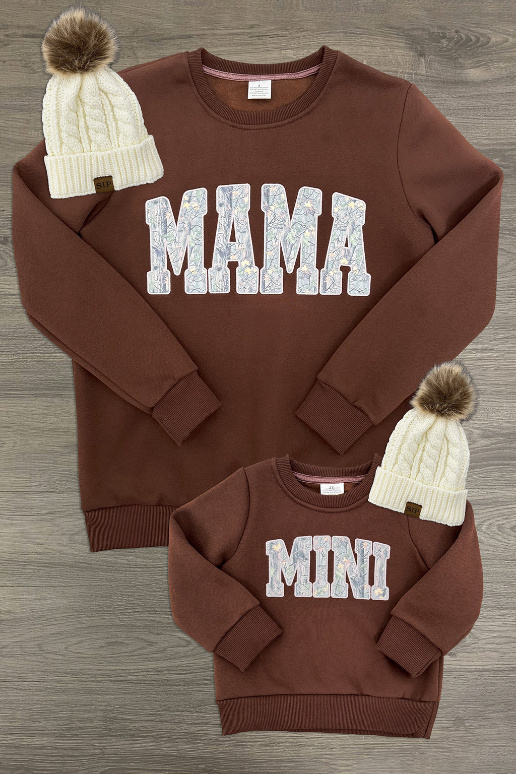Mom & Me - "Mama & Mini" Camo Sweatshirt - CHILD-6-12 Months - Brown sweatshirt set with white terry fabric "MAMA" and "MINI" text, ribbed cuffs, and matching knit hats with pom-poms.