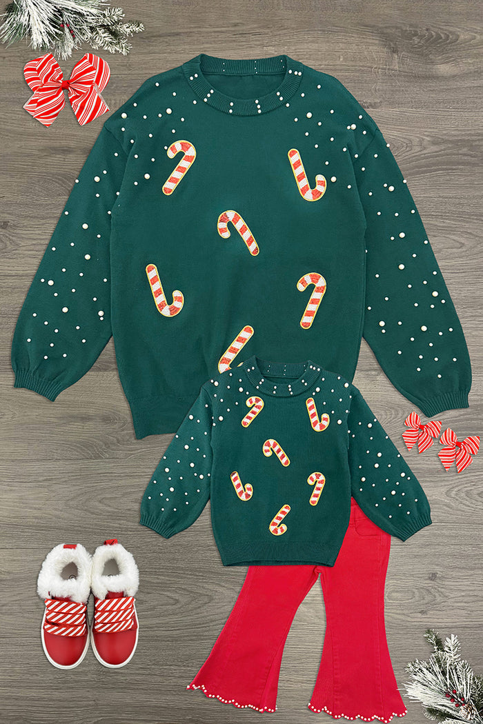 Mom & Me - Candy Cane Sweater & Denim Pant Set - CHILD-6-12 Months - Matching dark green sweaters with candy cane prints, styled with bright red flared pants and red shoes.