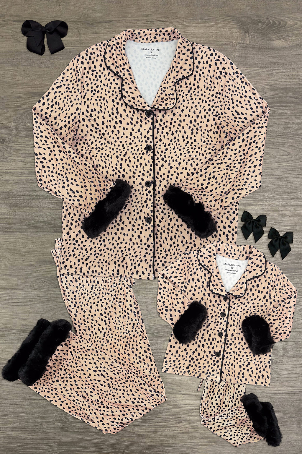 Mom & Me - Fuzzy Cheetah Pajamas - CHILD-6-12 Months - Matching fuzzy cheetah-print pajamas with black faux fur cuffs, adult and child sizes, button-up tops and pants laid flat on