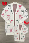 Mom & Me - Cozy Red & Green Bow Cardigan - CHILD-6-12 Months - Cream cardigan with repeated red and green bow patterns, long sleeves, button-down front, and pockets on larger size and.