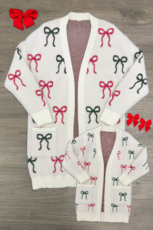 Mom & Me - Cozy Red & Green Bow Cardigan - CHILD-6-12 Months - Cream cardigan with repeated red and green bow patterns, long sleeves, button-down front, and pockets on larger size and.