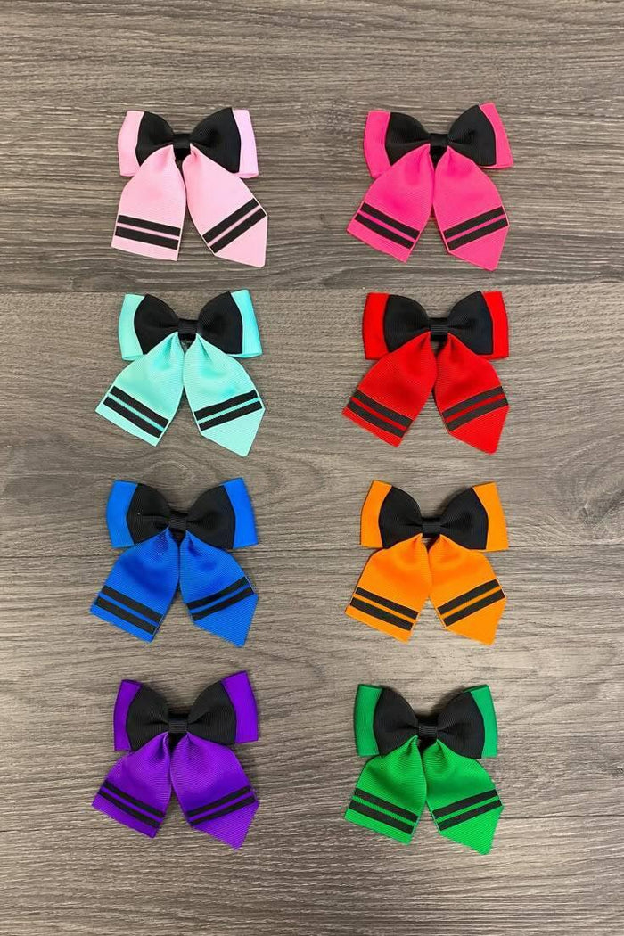 Crayon Trendy Bows - Light Pink - Nine pairs of colorful hair bows with black center bows, arranged in three columns on a wooden surface.