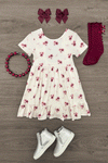 Pink Flowers & Bows Dress - 6-12 Months - White short-sleeve dress with pink and purple floral print, gathered waist, paired with burgundy bows, matching socks,.