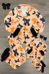 Mom & Me - Fuzzy Orange & Black Bow Pajamas - CHILD-6-12 Months - Matching orange fuzzy pajamas with large black bows, black cuffs, and button-up tops for mom and child, styled flat with.