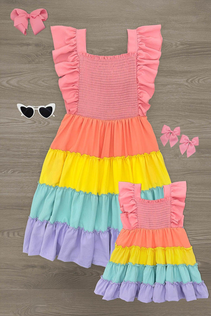Mom & Me - Rainbow Pastel Ruffle Dress - CHILD-6-12 Months - Rainbow pastel ruffle dress with pink smocked bodice and tiered skirt, matching bow headbands, and white heart sunglasses.